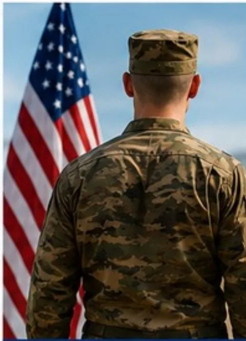 Service member standing in front of an American flag