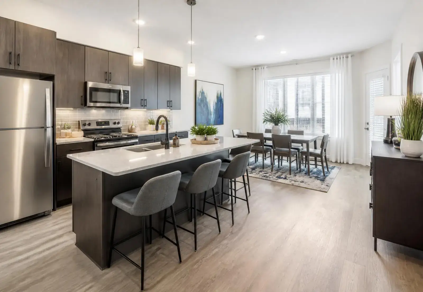 Modern furnished apartment kitchen and dining area